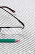 glasses and  pencil