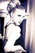 Attractive retro woman in old house