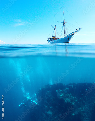 Photo: Divers on a shipwreck Divers on a shipwreck