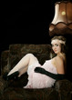 The girl in style 30 on an armchair The girl in style 30 on an armchair