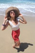 Beautiful young woman having fun at the sun