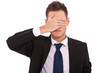 business man making the see no evil gesture business man making the see no evil gesture