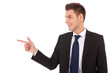 young business man pointing to the side young business man pointing to the side