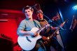 Foto: musician plays a guitar musician plays a guitar