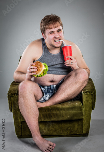 Photo: fat man eating hamburger fat man eating hamburger