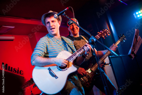 Photo: musician plays a guitar musician plays a guitar