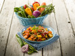 mixed sauteed vegetables on dish over wood background mixed sauteed vegetables on dish over wood background