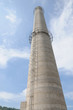 A new chimney against blue sky in a coke plant