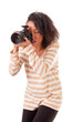 attractive dark skinned girl with a camera on a white background