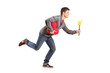 Young man running with a bunch of flowers and red heart shape ob