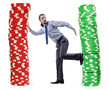 Businessman and casino chips on white