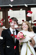 Just married couple under a rain of rose petals
