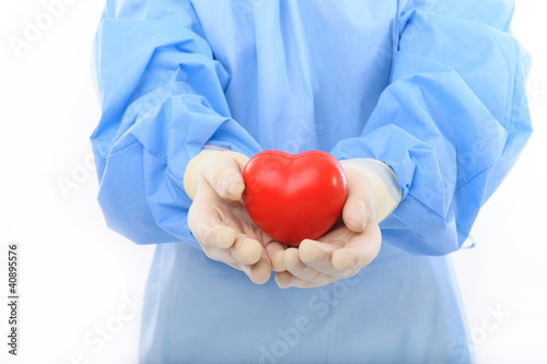 Photo: sterile doctor holding heart sterile doctor holding heart