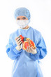 Photo: female doctor or nurse holding a heart female doctor or nurse holding a heart