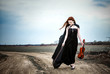 The red-haired girl with a violin outdoor
