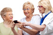 Photo: Three elderly women with cellphone. Three elderly women with cellphone.