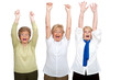 Three senior women raising hands.