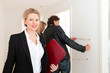 Young couple looking for real estate with female realtor