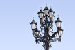 Retro styled lighting lantern over blue sky Retro styled lighting lantern over blue sky