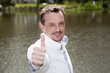 casual man with thumbs up