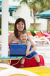 happy mother and toddler with laptop happy mother and toddler with laptop