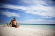 Asian guy relaxing on the beach