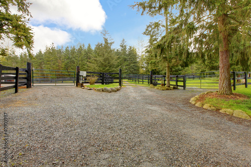 Photo: Horse farm gravel road with three gates. Horse farm gravel road with three gates.