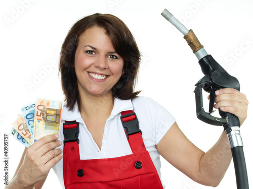 Photo: Woman is happy to save ready cash for fuel Woman is happy to save ready cash for fuel