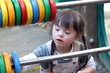 Portrait of beautiful young girl on the playground.