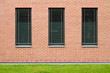 Front wall of a new brick building with windows