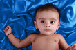 Baby boy with blue satin background