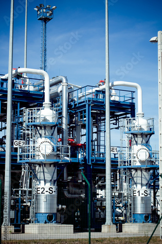 Photo: petrochemical refinery pipes and tanks in a factory petrochemical refinery pipes and tanks in a factory