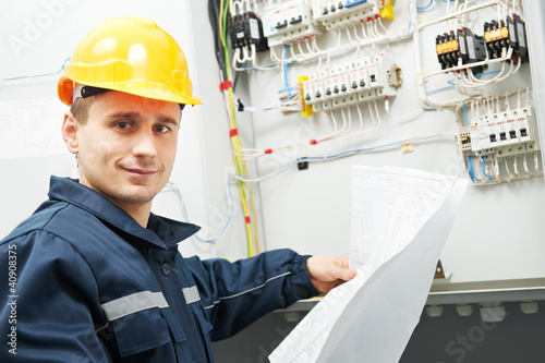Photo: Electrician checking cabling power line Electrician checking cabling power line