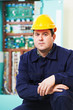 Electrician portrait over distribution power box