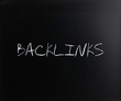 "Backlinks" handwritten with white chalk on a blackboard