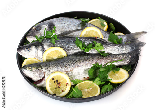 Photo: Fresh fishes with lemon, parsley and pepper Fresh fishes with lemon, parsley and pepper