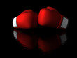 Boxing gloves in dark background with reflection