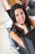 Photo en ligne au meilleur prix Smiling secretary sitting at her desk