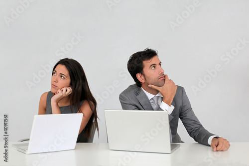 Photo: Business team with puzzled look Business team with puzzled look