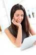 Portrait of smiling student using electronic tablet