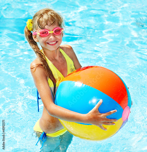 Photo: Child swimming in pool. Child swimming in pool.