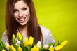 Portrait of a girl with white and yellow tulips