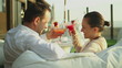 Young happy couple drinking exotic cocktails outdoors