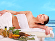 Woman getting spa treatment outdoor.