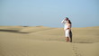 Young couple enjoying beautiful view in desert