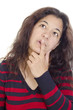 thoughtful young woman and the index finger on her lips thoughtful young woman and the index finger on her lips