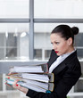 Tired secretary with a lot of documents