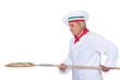 Italian chef putting a pizza in the oven