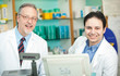 Portrait of two chemists in a drug store Portrait of two chemists in a drug store
