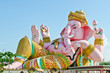 Pink ganesha statue in relaxing action Pink ganesha statue in relaxing action